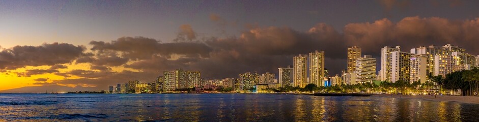 Honolulu at Dusk. The majestic city lights complemented by the golden glow of sunset.