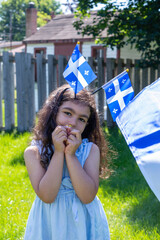 Girl celebrates the national holiday,
Drapeau qu&eacute;bec - Happy Quebec Day
Quebec's National Holiday,
La Fete Nationale du Quebec,
St. Jean-Baptiste