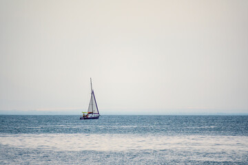 Obraz premium Sailing yacht in the blue calm sea.