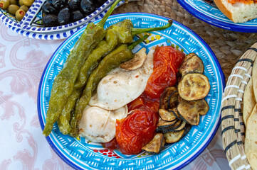 Plat typique tunisien Kafteji, plat de gastronomie tunisienne &agrave; base d'oeufs , de thon rouge, poivron, harissa , huile d'olive et d'autres legumes, Tunisian sandwich
