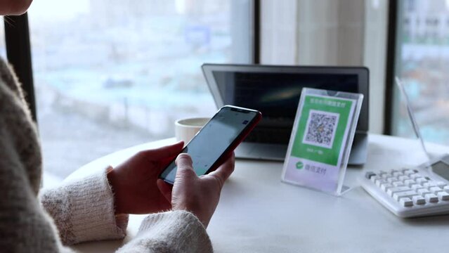Scan QR code payment on WeChat with smartphone