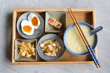 Typical Chinese breakfast and lunch. Millet Porridge with Fermented Beancurd, Pan-fry Char Choy (Pickled Mustard Root) Dried Shrimps Beancurd, Scrambled Egg Fried Silverfish and Salted Duck Egg.