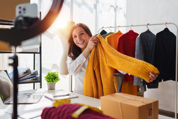 Portrait of Small Business SME owners live stream by smart phone. Online shopping concept