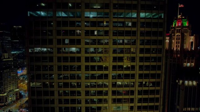 from river sliding after a office building revealing landscape of urban life from chicago. Aerial Illinois USA 4k
