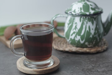 Traditional Javanese tea served with palm sugar for a sweet, creamy flavor. Enjoy the authentic taste of Indonesia in every sip