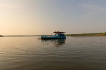 ferry on the mandovi river to get to divar island © MalcStock
