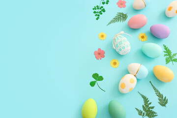 Top view of easter colorful eggs over pastel blue background