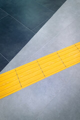 Footpath or yellow tactile tiles for the blind, top view, copy space.