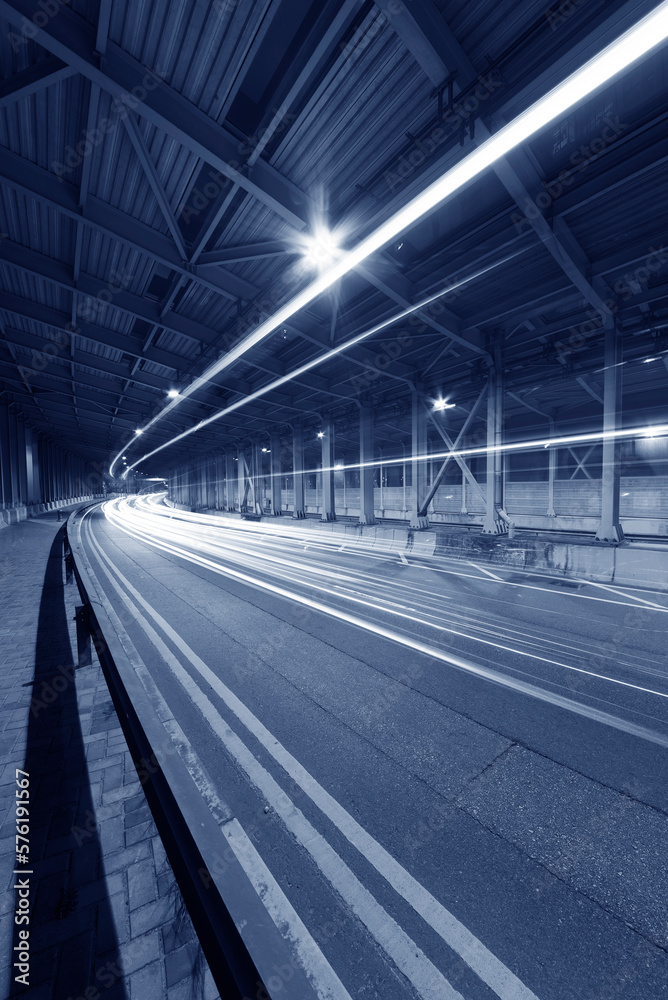 Aufkleber light trails and head lights of traffic in tunnel. transportation background