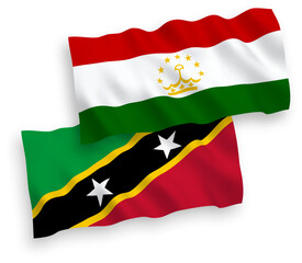 Flags of Federation of Saint Christopher and Nevis and Tajikistan on a white background