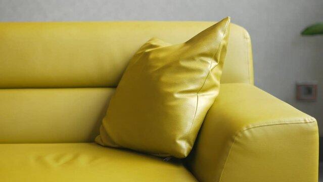 yellow color modern sofa with pillows in living room at home