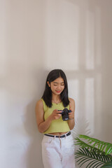 Needlework concept, Women checking picture of handicraft on camera and smiling with happiness