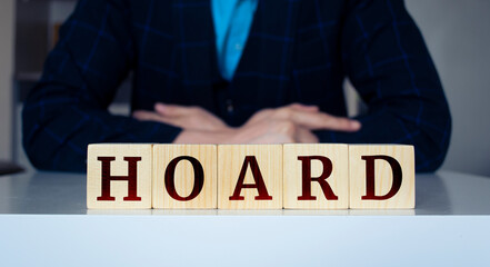 The word "Hoard" written on wood cube. © Uuganbayar