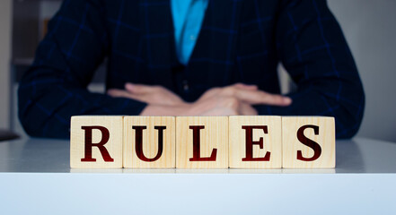 The word Rules written on wood cube. Business concept