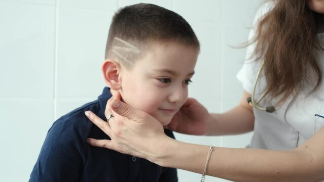 close-up doctor probing the boy's neck
