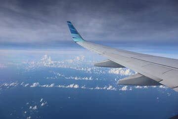 The plane's wings are visible from the window, shortly after landing