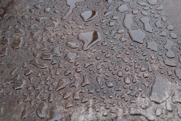 A Glimpse of Perfection: The Beauty of Water Drops on Metal