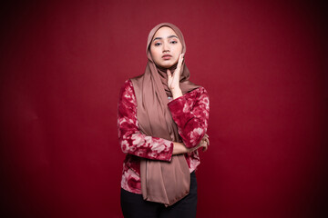 Portrait of hijab girl smiling. Pretty muslim girl. Beautiful asian muslimah woman model posing on background studio.