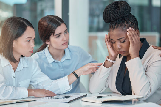 Headache, stress and support with a business black woman suffering from burnout while colleagues console her. Anxiety, mental health and depression with a female employee group comforting a coworker