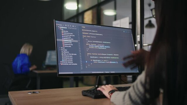 African And Asian IT-Specialists Working Together In Office, Man And Woman Discussing Project