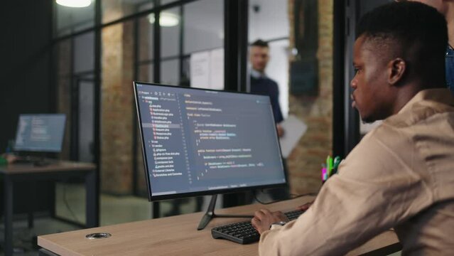 African American Programmer Working Of Development New Software And Optimization Of Company Work