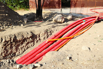 the length of pipes underground. red pipes in the pit