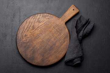 Wooden cutting board and kitchen towel