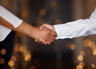 Partnership, deal and business people shaking hands in a office with a bokeh background. Welcome,...