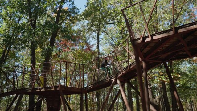 Charlotte Batty riding the infamous mountain bike trailhead at Coler Mountain in Bentonville Arkansas.