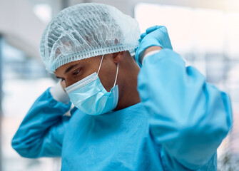 Surgeon, doctor and surgery with face mask and health, man in ppe for safety, operation and ready...