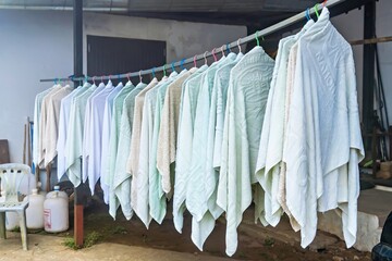 Chiang Mai, Thailand - December, 18, 2022 : Laundry and dried of white towel at Chiang Mai, Thailand