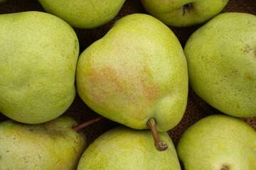 Green pear close-up, fresh fruit natural background.