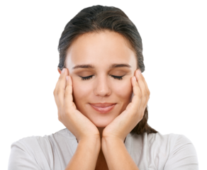 A beautiful caucasian female model satisfied after the spa treatment and sitting with eyes closed and relaxing after facial treatment in the spa isolated on a png background.