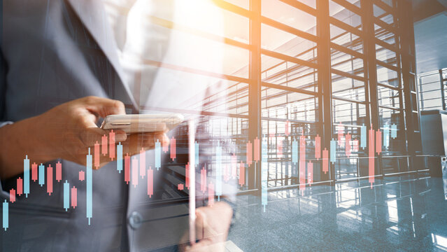 Abstract building and double exposure businessman, businessman using a smartphone to plan strategic goals planning for industry growth development concept marketing sector success and team ideology.