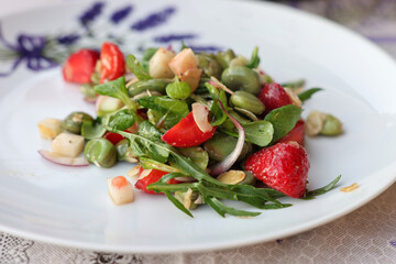 salad with strawberries and broad beans. Delicious dish in a healthy style