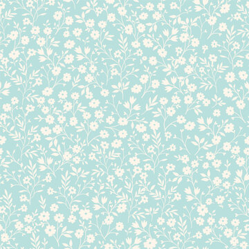 Vintage seamless tiny floral pattern. Turquoise background with small light yellow flowers. Design for wallpaper, clothing, packaging, fabric, cover, textiles