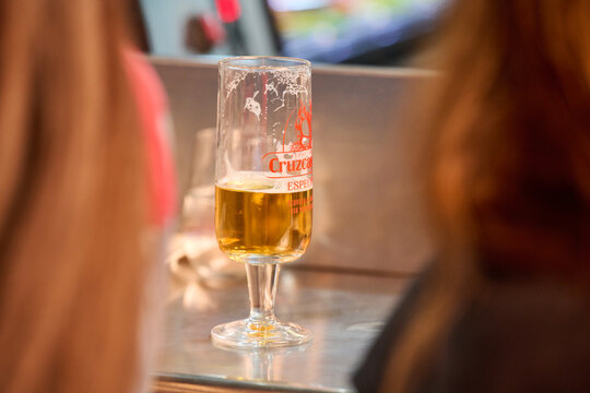 glass of Cruzcampo beer in bar