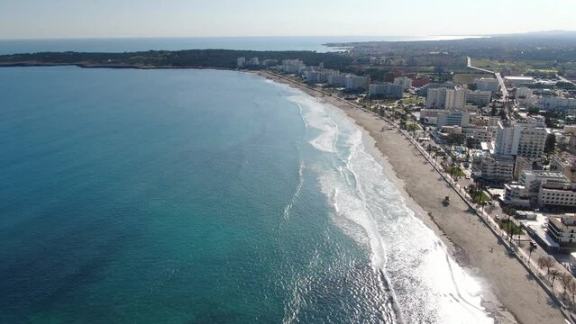 Aerial footage videoof  Cala Millor beach in the island of Majorca. Summer, beach, holiday, resort and vacation scene.