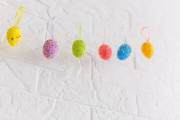 Easter eggs painted in pastel colors on a white background.