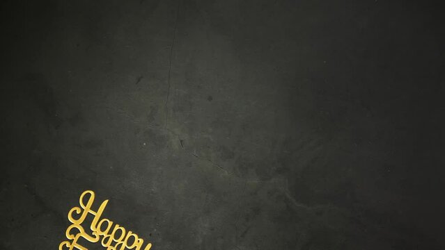 Dad text gold shiny letters on black concrete background, Happy Father's Day Greeting gold effect on dark background copy space, moving from left to right with King crown