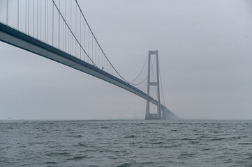 Fototapeta premium overcast and dperessed moody weather with the Big Belt bridge in Denmark
