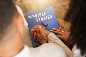 Religion, studying and couple holding hands with a bible for worship, prayer and trust in...
