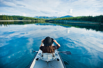 High angle view of woman with hat in boat, British Columbia, Canada