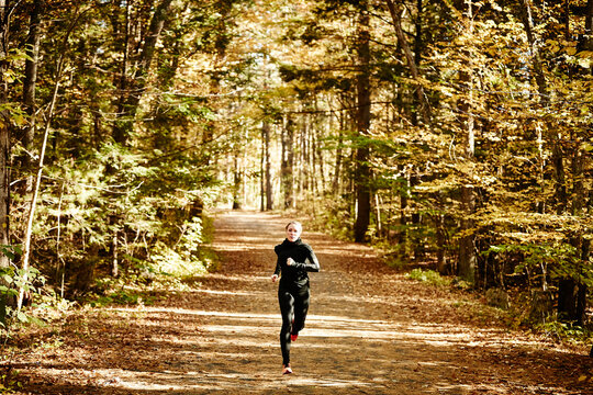 Woman jogging in forest