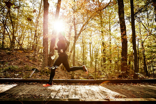 Woman jogging in forest