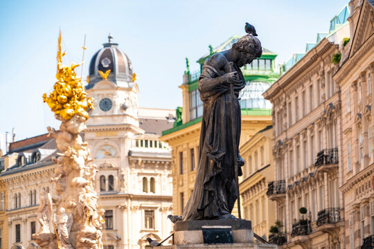 The Pestsa&Atilde;&curren;ule and a statue of a priest near Stephan's square