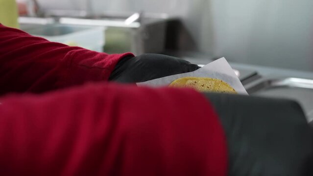 Making pork tacos on a soft shell corn tortilla - food truck series