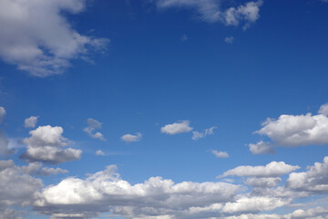 Beautiful calm sky landscape with light white clouds high in the stratosphere on a sunny day...