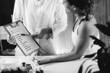 Immunology Doctor Looking at a List With Allergens