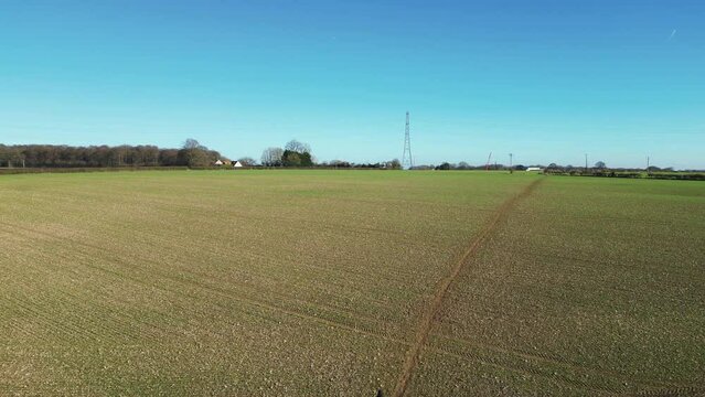 Drone following a man walking along a field path in Great Missenden